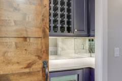 C&M Cabinets and Millwork custom wet bar with wine rack